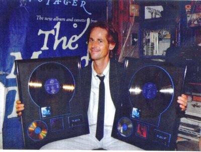 Alan displays the gold album awards recieved for The Moody Blues 